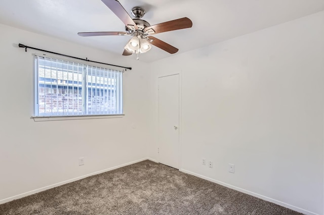 empty room featuring carpet floors and ceiling fan