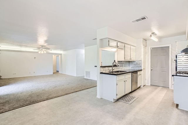 kitchen featuring dishwasher, light carpet, sink, ceiling fan, and decorative backsplash