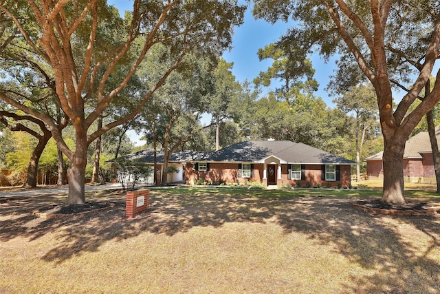 ranch-style home with a front yard