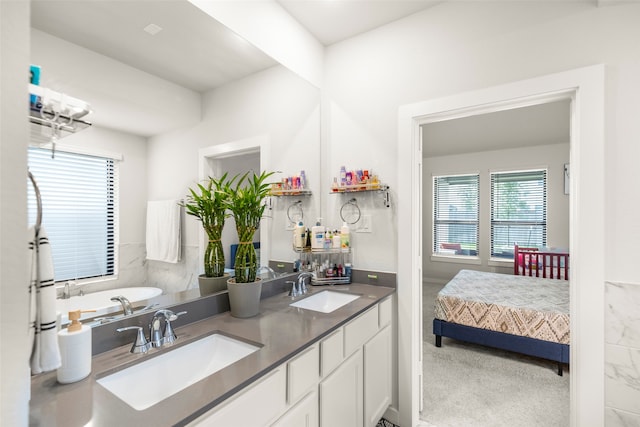 bathroom with plenty of natural light and vanity