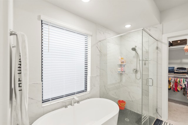 bathroom with independent shower and bath and tile patterned flooring