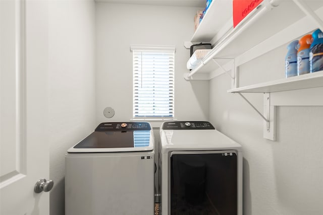 laundry area with separate washer and dryer