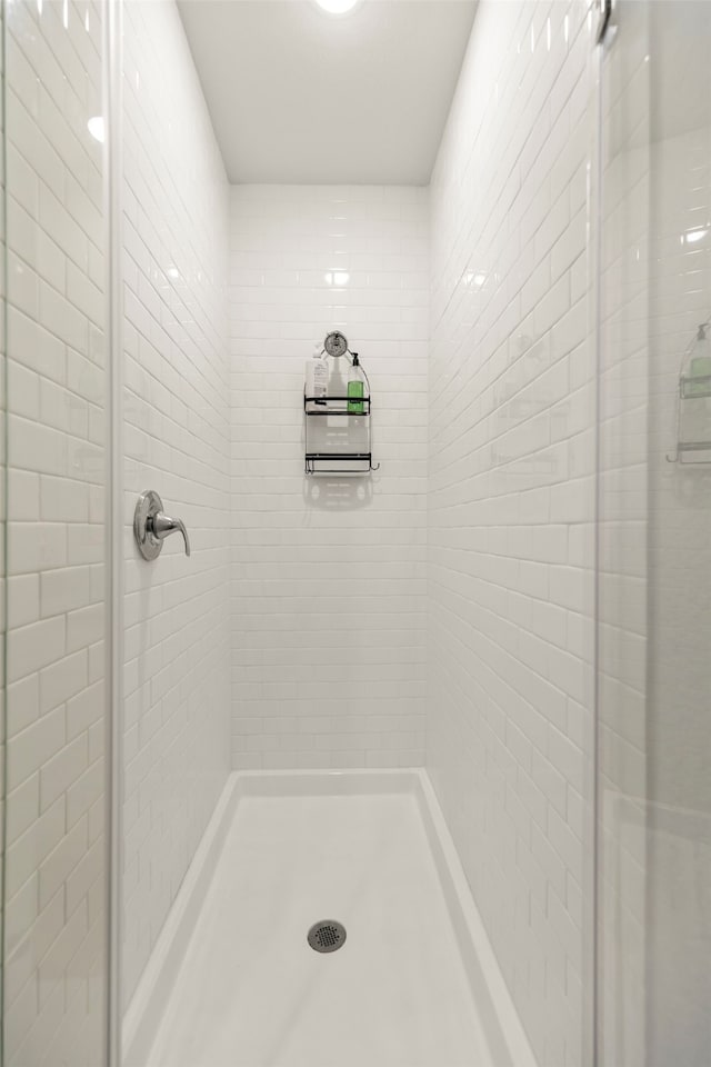 bathroom with tiled shower