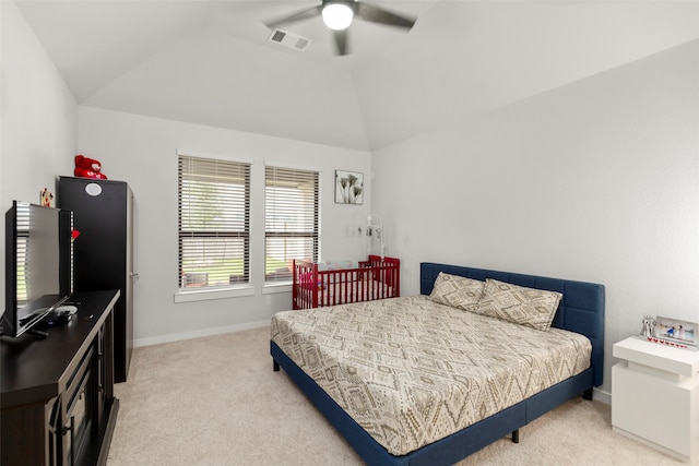 carpeted bedroom featuring lofted ceiling and ceiling fan