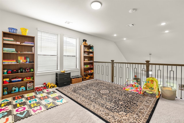 recreation room featuring lofted ceiling and carpet flooring