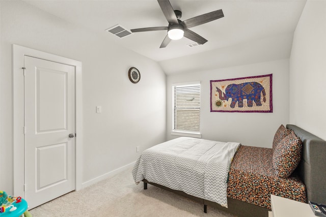 carpeted bedroom featuring vaulted ceiling and ceiling fan