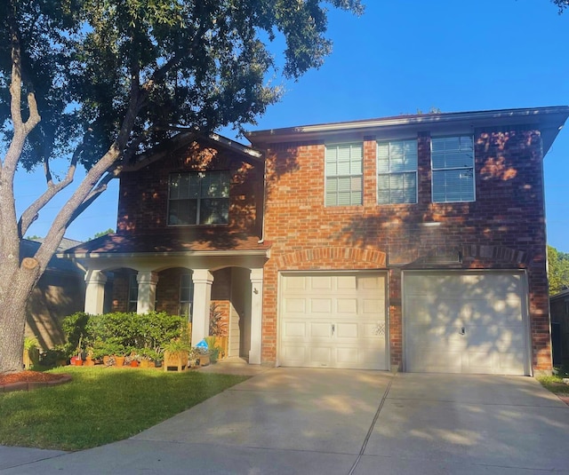 view of front of house with a garage and a front yard