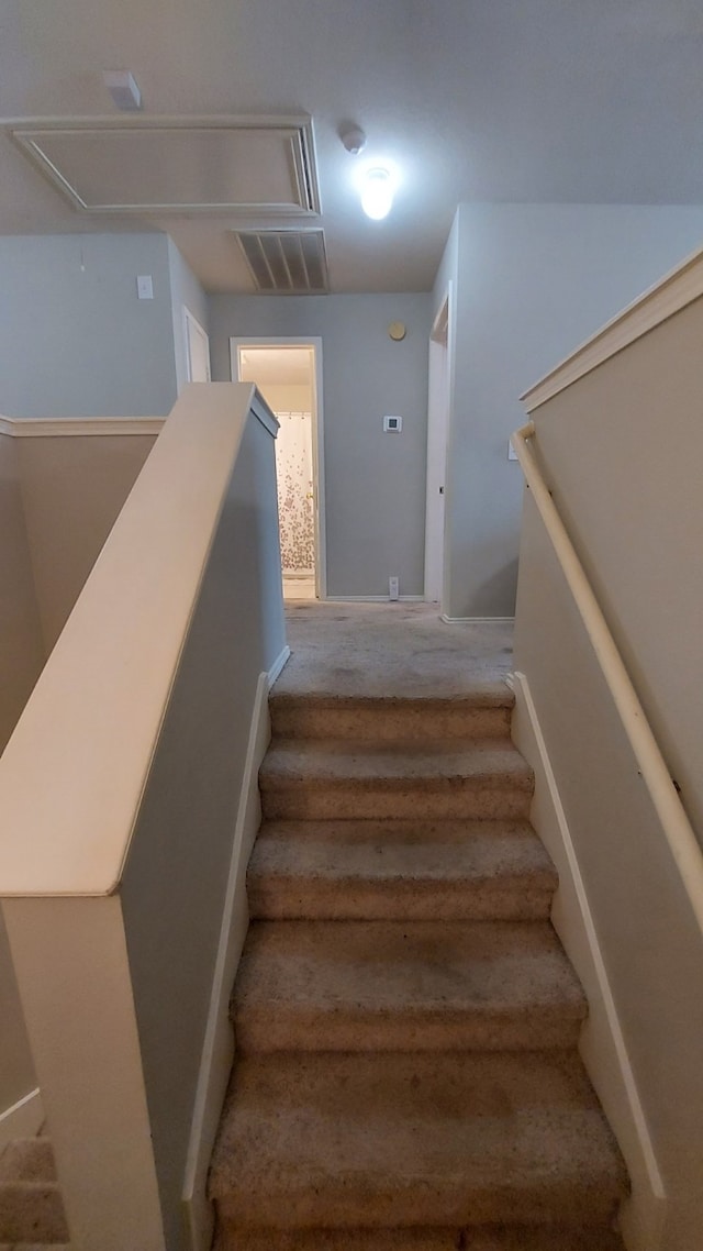 stairs featuring wood-type flooring