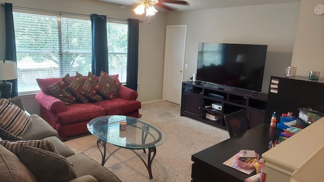 living room with light carpet, plenty of natural light, and ceiling fan