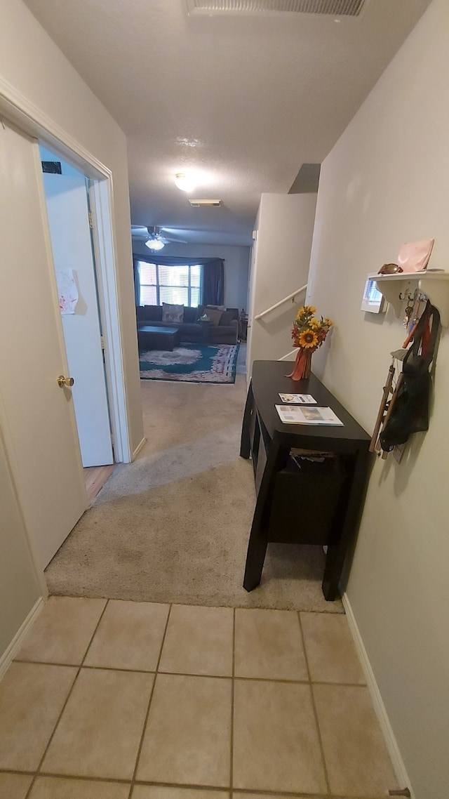 hallway with light tile patterned floors