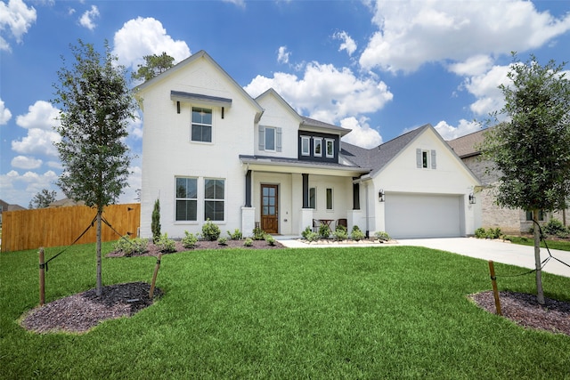 view of front facade featuring a garage and a front yard