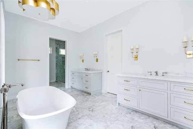 bathroom featuring vanity and shower with separate bathtub