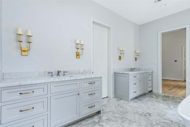 bathroom featuring a tub and vanity