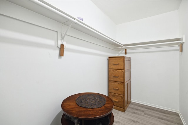 spacious closet featuring hardwood / wood-style floors