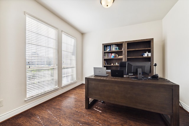 office area featuring a wealth of natural light and dark hardwood / wood-style flooring