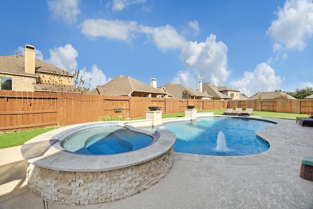 view of pool featuring a patio, pool water feature, and an in ground hot tub