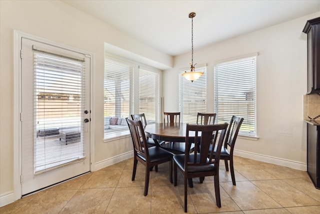 dining area featuring light tile patterned floors