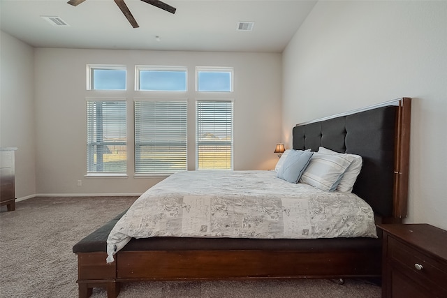 bedroom featuring lofted ceiling, carpet flooring, multiple windows, and ceiling fan