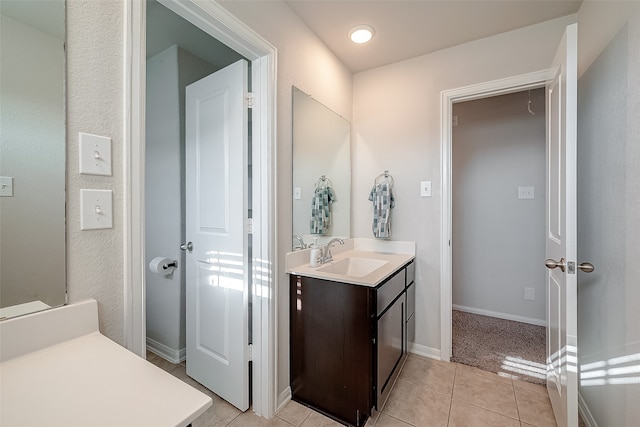 bathroom with tile patterned floors and vanity