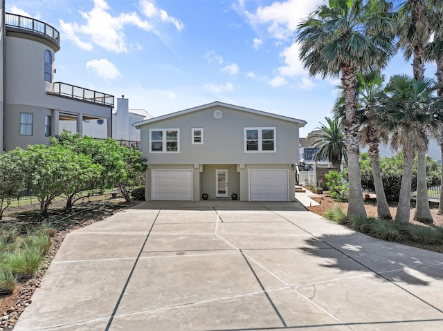 view of front facade featuring concrete driveway and an attached garage