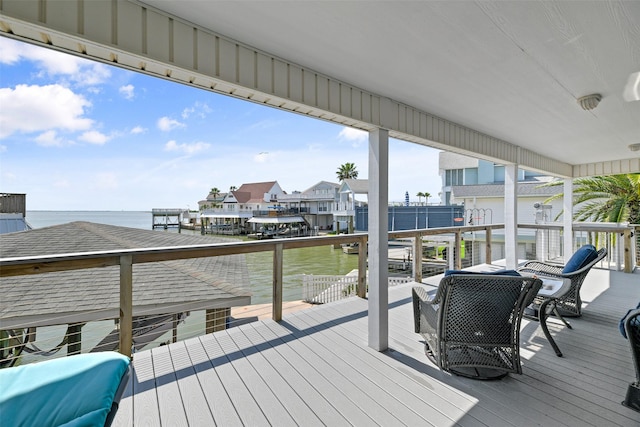 1239 Oahu Dr, Tiki Island, TX 77554 - wooden terrace featuring a water view and a residential view