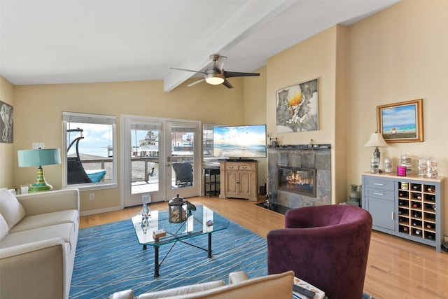 1239 Oahu Dr, Tiki Island, TX 77554 - living room with light wood finished floors, a fireplace, and ceiling fan