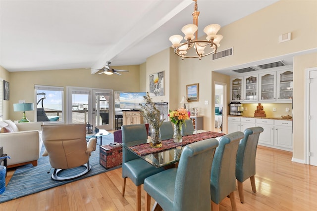 1239 Oahu Dr, Tiki Island, TX 77554 - dining space with a chandelier, light wood-style flooring, and ceiling fan