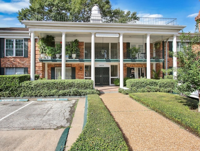 view of front of home with a balcony