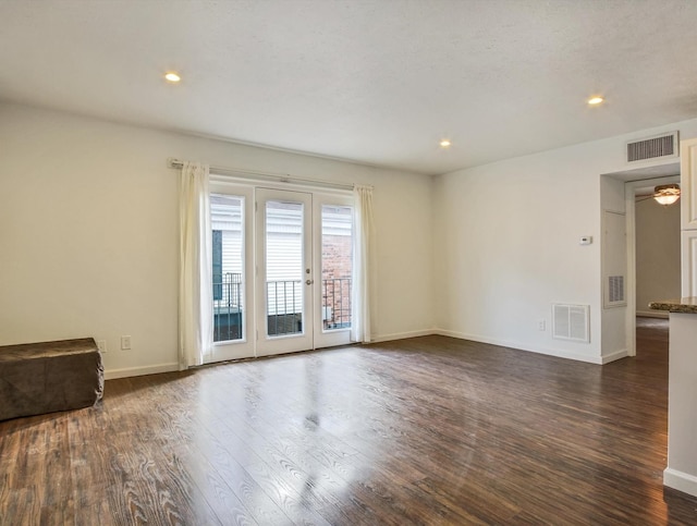 spare room featuring dark hardwood / wood-style floors