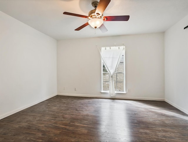 unfurnished room featuring ceiling fan and dark hardwood / wood-style floors