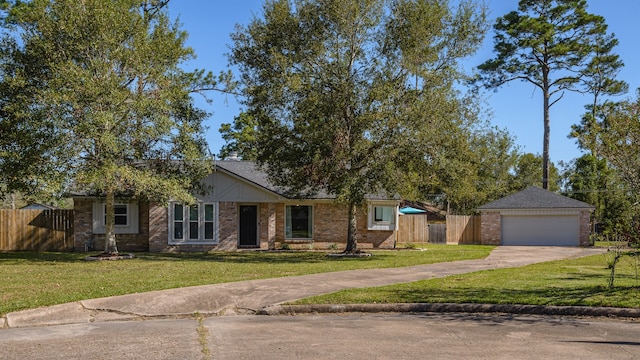 ranch-style home with a garage and a front lawn