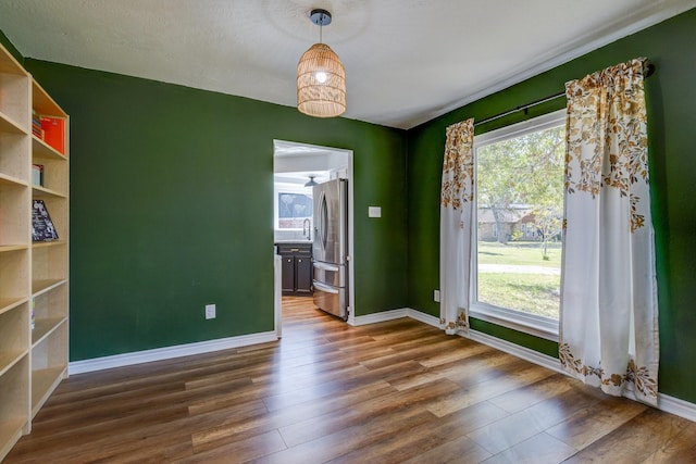 unfurnished room featuring dark wood-type flooring