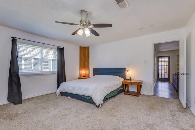 bedroom featuring ceiling fan and light colored carpet