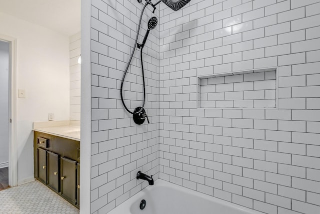 bathroom featuring vanity and tiled shower / bath combo