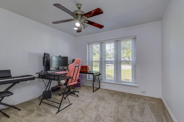 home office featuring ceiling fan and light colored carpet