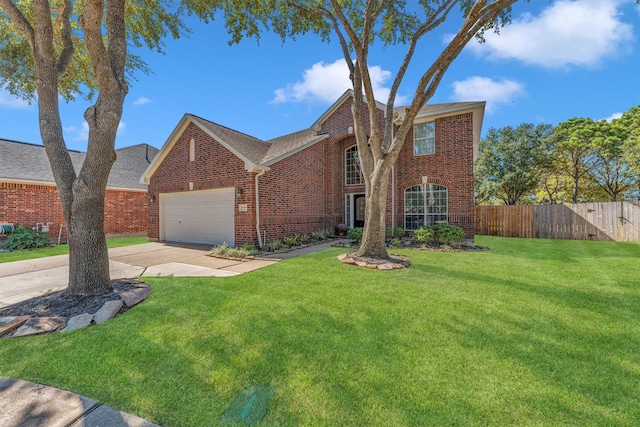 view of front of house featuring a front yard and a garage