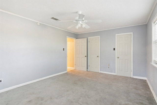 unfurnished bedroom with carpet, ceiling fan, and ornamental molding