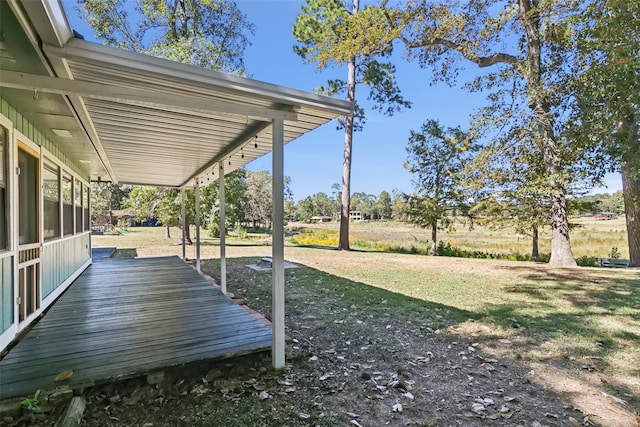 view of yard with a sunroom