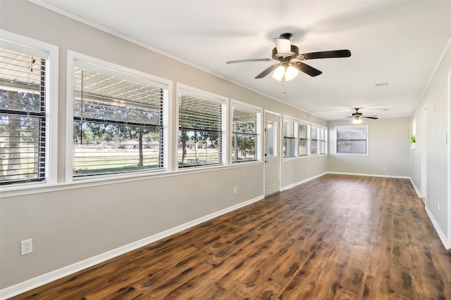 unfurnished room with ornamental molding, ceiling fan, and dark hardwood / wood-style flooring