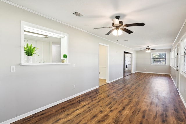 spare room featuring ornamental molding, ceiling fan, and dark hardwood / wood-style flooring