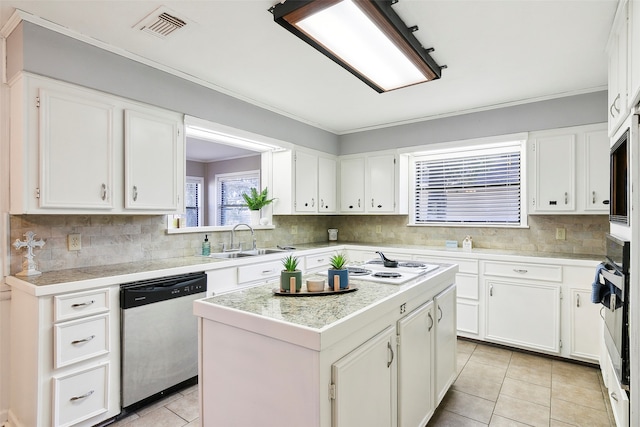 kitchen with white cabinetry, a center island, stainless steel dishwasher, and sink