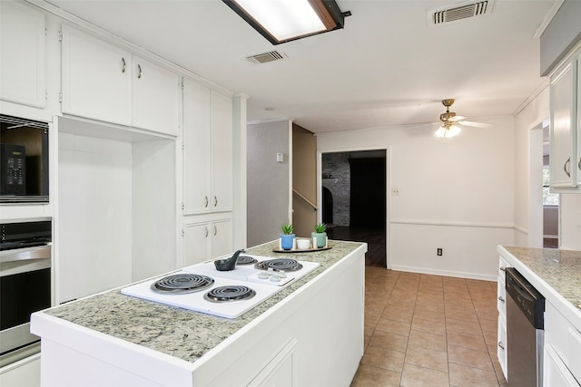 kitchen with light tile patterned flooring, a kitchen island, white cabinetry, ceiling fan, and stainless steel appliances