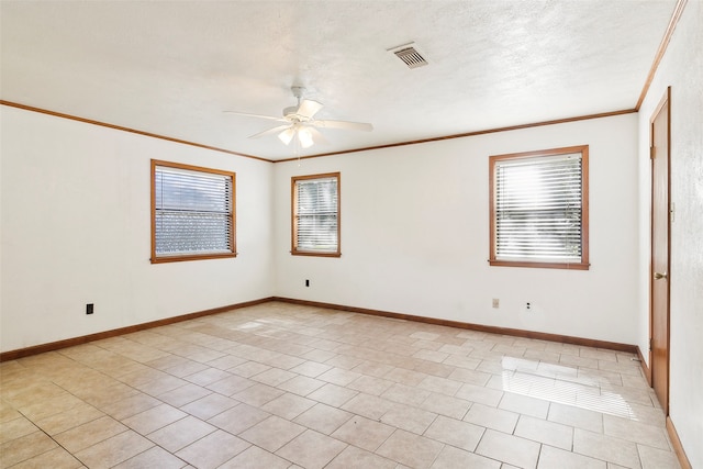 tiled spare room featuring crown molding, a textured ceiling, and ceiling fan