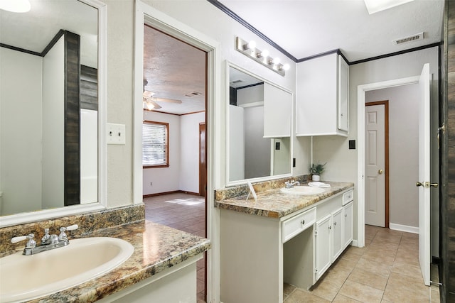 bathroom featuring vanity, crown molding, tile patterned floors, and ceiling fan