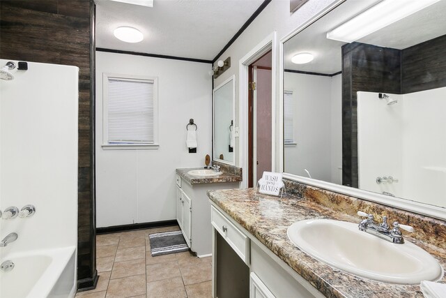 bathroom featuring  shower combination, a textured ceiling, tile patterned floors, vanity, and ornamental molding