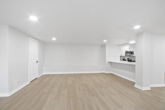 basement with light wood-type flooring