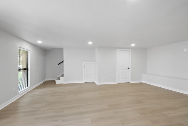 basement featuring light hardwood / wood-style floors