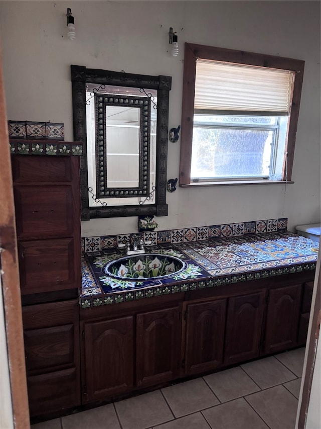 bathroom featuring tile patterned floors and sink