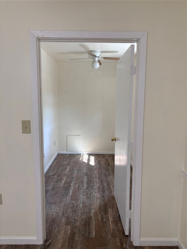 interior space featuring dark wood-type flooring and ceiling fan