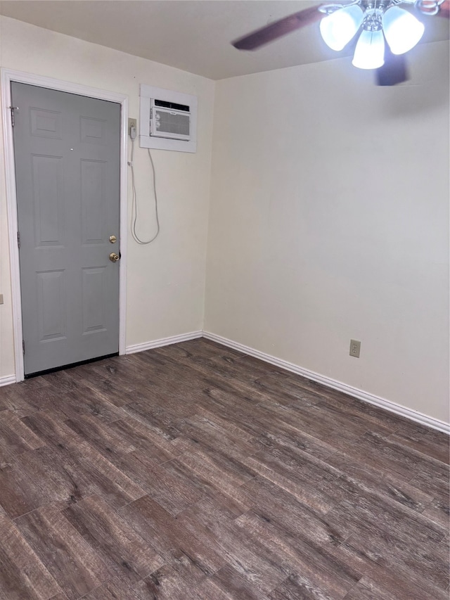 entryway featuring ceiling fan, dark wood-type flooring, and a wall unit AC